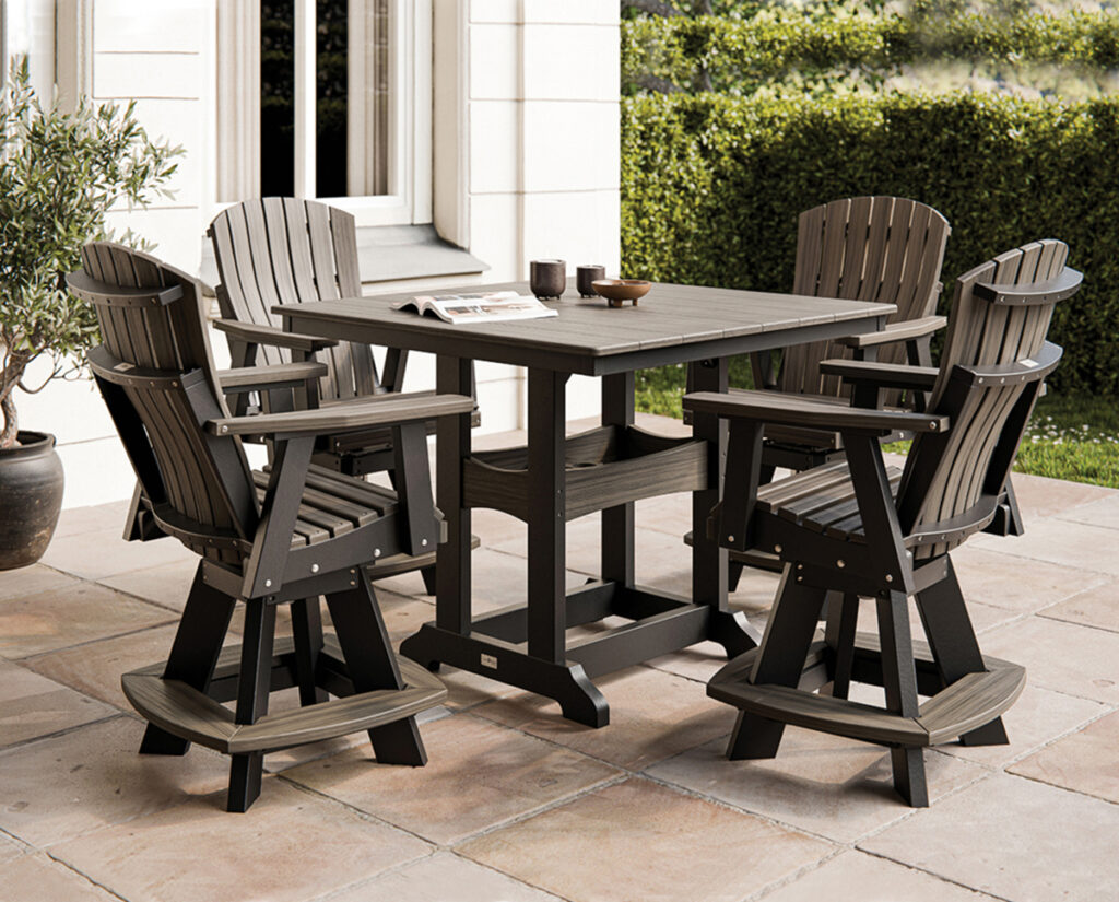 Outdoor furniture dining set with four chairs and square table on a stone patio